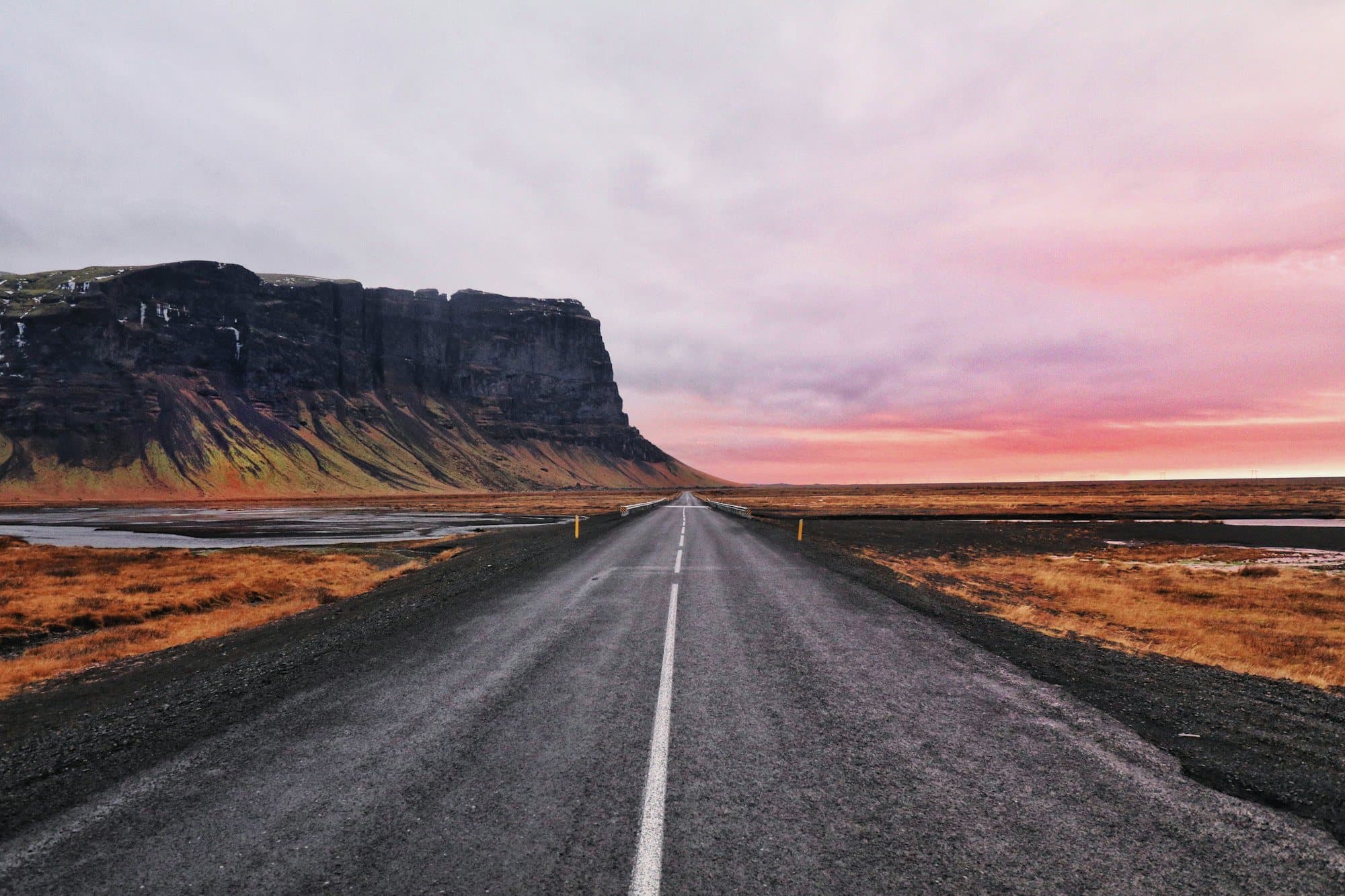 The ring road in southern Iceland under a pink evening sky